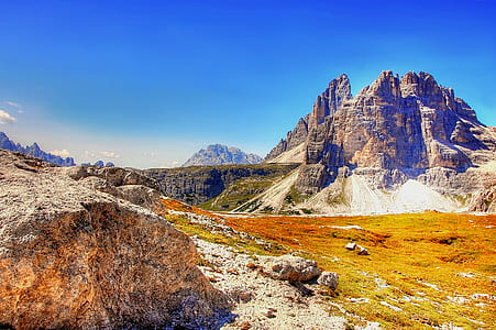 rock mountain under blue sky during daytime thumbnail