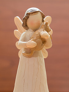angel holding bear plush toy wooden sculpture thumbnail