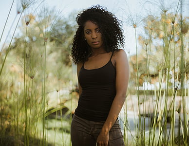 woman in black tank top posing thumbnail
