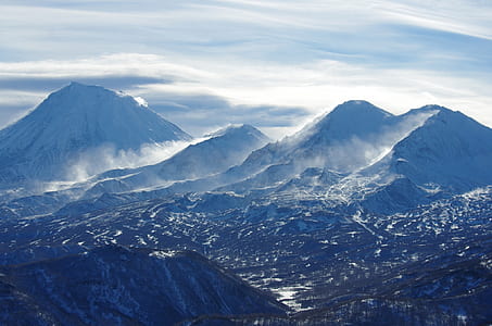 mountains under cloudy sky thumbnail
