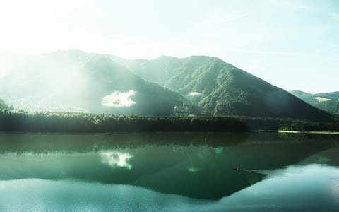 body of water with mountain thumbnail