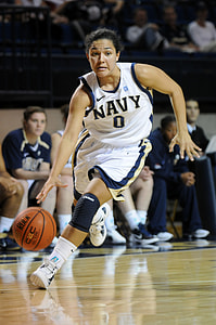 woman playing basketball on basketball court thumbnail