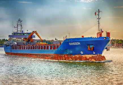 blue and brown cargo vessel on body of water thumbnail