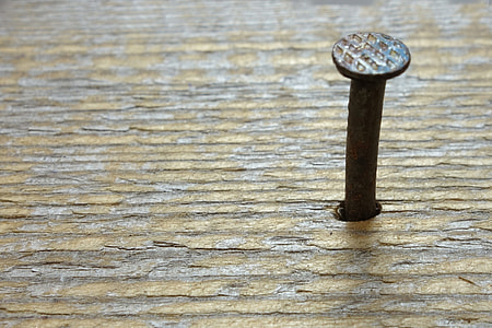closeup photography of brown wooden surface with gray nail thumbnail
