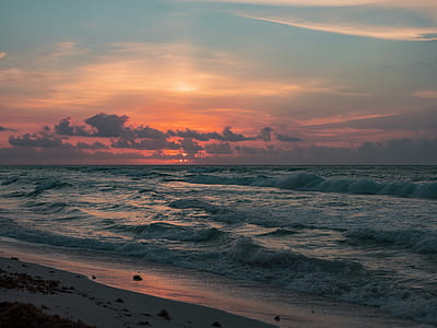 sea wave on beach during sunset thumbnail