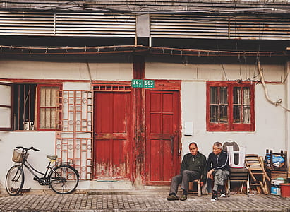 two men sitting on chair thumbnail