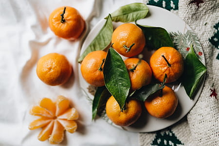 Still life of mandarin oranges with leaves thumbnail