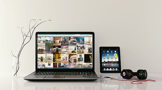 black laptop computer with corded headphones thumbnail