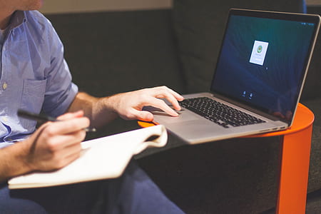 person using black and gray laptop computer thumbnail