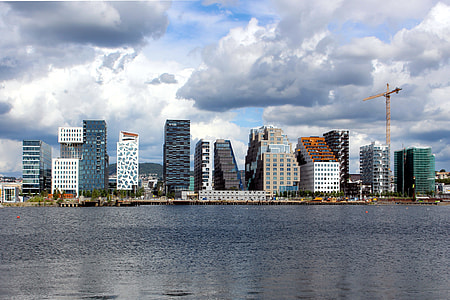 landscape photo of city across body of water thumbnail