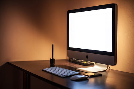 tilt shift lens photography of silver iMac thumbnail