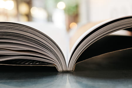 shallow focus photography of white book thumbnail