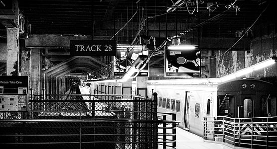 grayscale photography of train station thumbnail