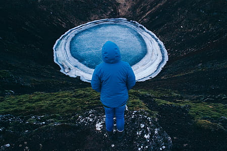 person on clif looking down thumbnail
