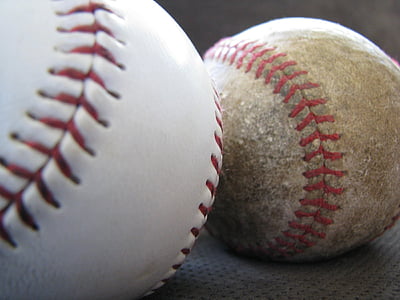 closeup photo of two baseball balls on cushion thumbnail