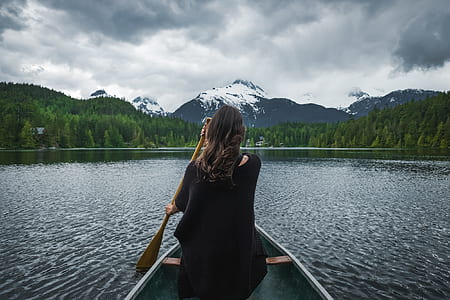 woman on boat sailing on body of water thumbnail