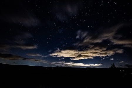 silhouette of trees under clouds formation thumbnail