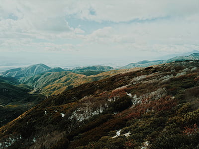 mountain under cloudy sky thumbnail