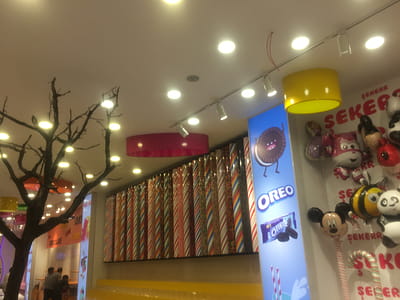 Mickey Mouse Balloon Beside Oreo Poster thumbnail