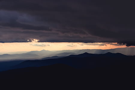 clouds and mountains during daytime thumbnail