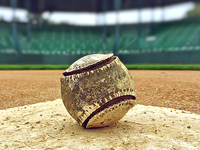 close-up photography of brown baseball on baseball plate thumbnail