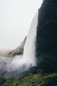 photo of waterfalls during daytime thumbnail