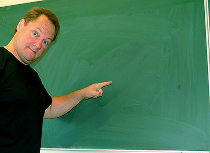 man pointing at chalkboard thumbnail