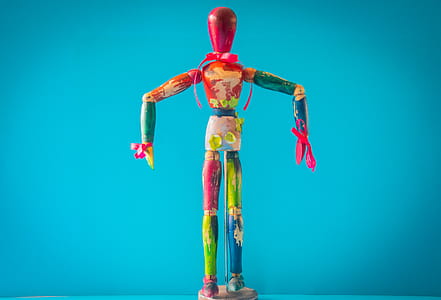 Selective Focus Photo of Multicolored Wooden Mannequin thumbnail