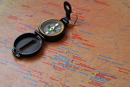 round black compass on map thumbnail