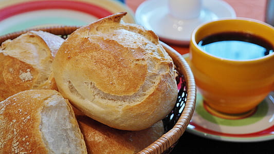 bread on bowl beside cup of cuffee thumbnail