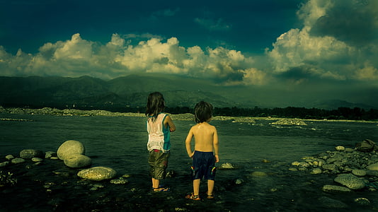 two children standing by the sea thumbnail