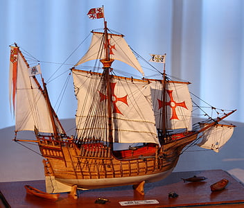 brown and white galleon ship scale model on brown surface thumbnail