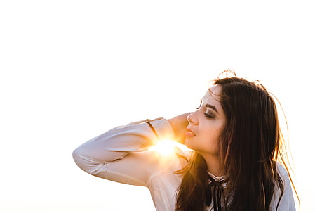 woman holding her right ear thumbnail