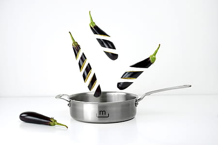 sliced eggplant and grey stainless steel cooking pot thumbnail