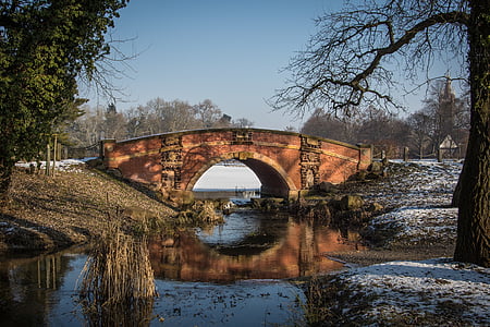 brown bridge over river during daytime thumbnail