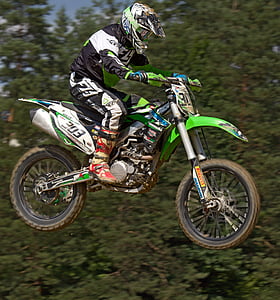 man riding at green dirt bike thumbnail
