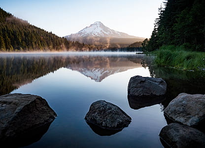 body of water with rock formation thumbnail