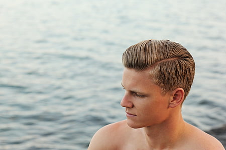 man's face near ocean thumbnail