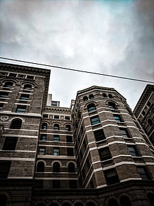 low angle-view of brown brick building thumbnail