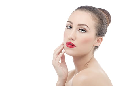 woman with red lip tint and black eyebrow thumbnail