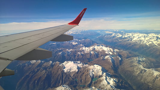 white airplane on sky thumbnail