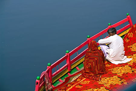 man sitting in front of sea thumbnail