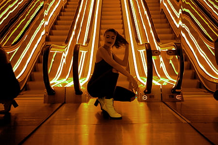 woman sitting near escalator thumbnail