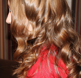side photo of woman brown curl hair thumbnail