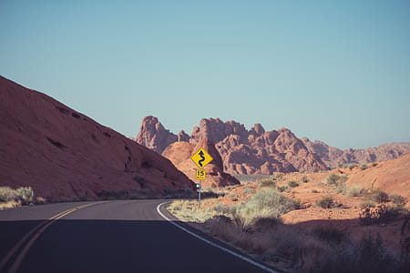 Road Sign Beside Grass thumbnail