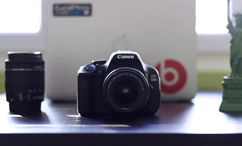 selective focus photography of black Canon EOS thumbnail