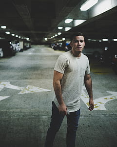 man standing in parking area thumbnail