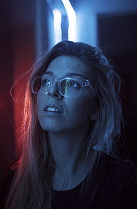 woman standing behind lighted wall thumbnail