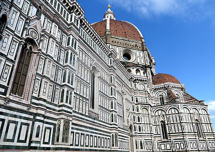 low angle white and brown concrete dome building during daytime thumbnail
