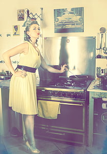 woman holding a gray ladle near gas range oven thumbnail